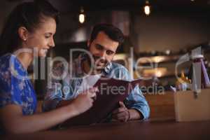 Couple looking at menu