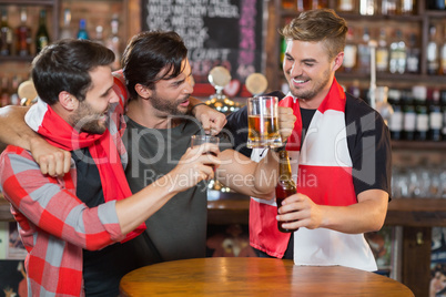 Happy friends enjoying in pub
