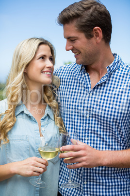 Young couple holding wineglasses