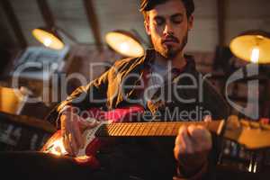 Young man playing guitar