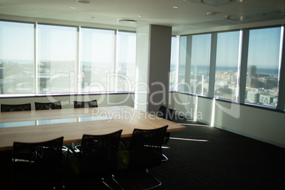 Empty table and chairs in office