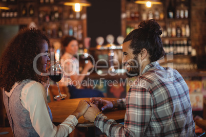 Romantic couple having red wine