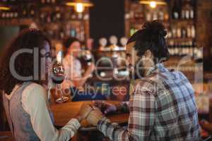 Romantic couple having red wine