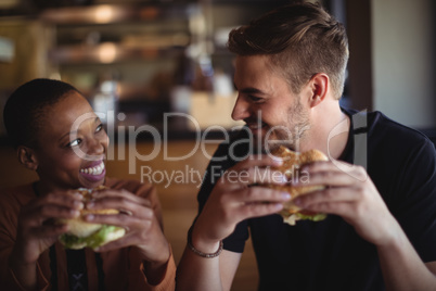 Happy couple having burger