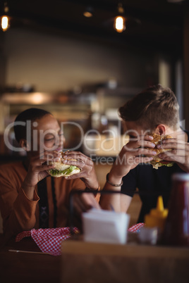 Happy couple having burger