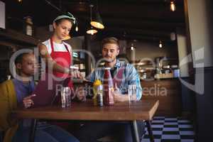 Waitress taking order at restaurant