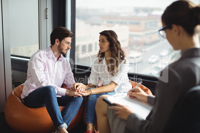 Couple talking to a marriage counselor