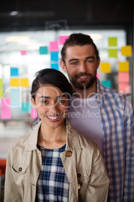 Portrait of smiling male and female executives