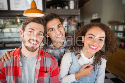 Portrait of smiling friends in restaurant