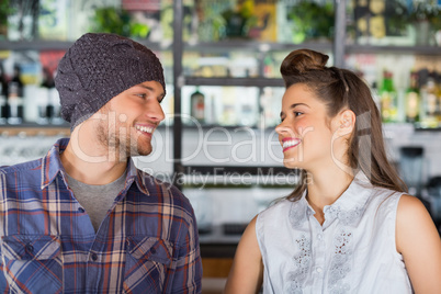 Friends looking at each other in restaurant