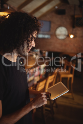 Young man using digital tablet