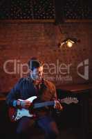 Young man playing guitar