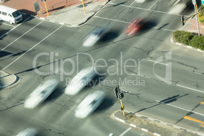 High angle view of blurred cars on road intersection