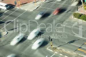 High angle view of blurred cars on road intersection