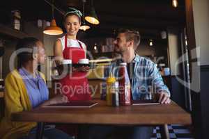 Waitress interacting with customer