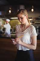 Waitress taking order at restaurant