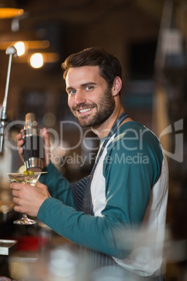 Portrait of bartender making drinks