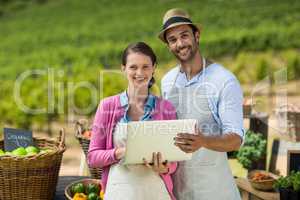 Portrait of smiling couple using laptop