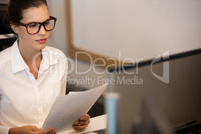 Young businesswoman reading documets