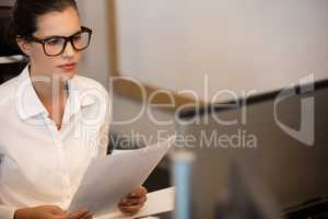 Young businesswoman reading documets