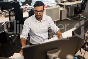 Young businessman working in office