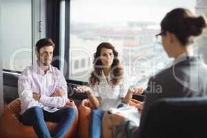 Couple talking to a marriage counselor during therapy