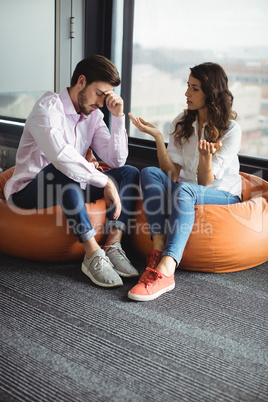 Annoyed couple interacting with each other