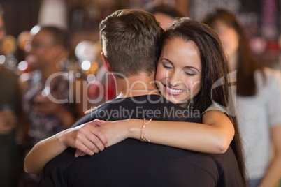 Happy woman hugging her boyfriend