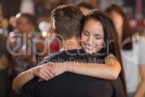 Happy woman hugging her boyfriend