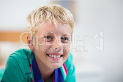Boy smiling at camera at home