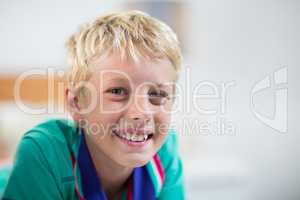 Boy smiling at camera at home