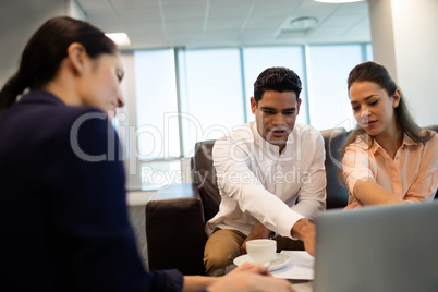 Business people discussing at meeting