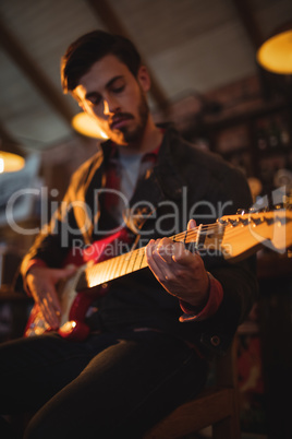 Young man playing guitar