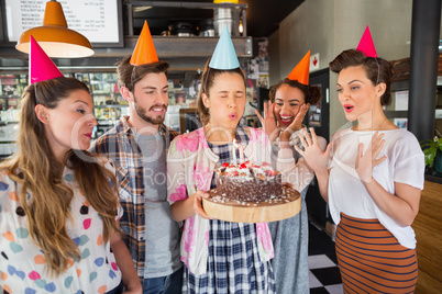 Friends celebrating birthday at restaurant