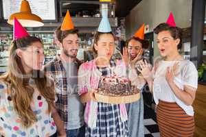 Friends celebrating birthday at restaurant