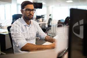 Concentrated businessman working in office