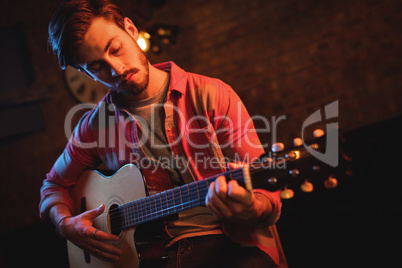 Young man playing guitar