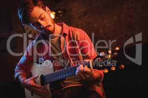 Young man playing guitar