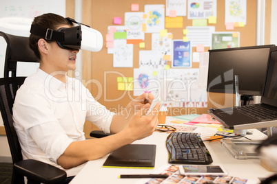 Man wearing vr glasses in creative office