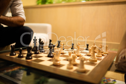 Close up of chess board on glass table