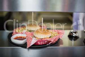 Close up of hamburgers served on table