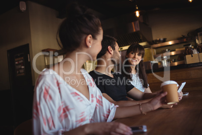 Friends having coffee at restaurant