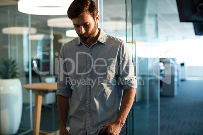 Uphappy businessman looking down