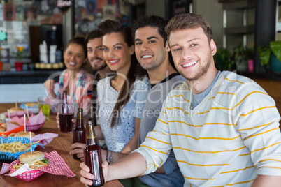 Friends having lunch with beer in restaurant