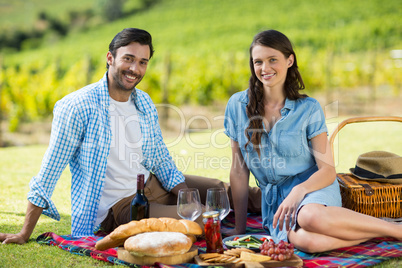 Portrait of happy couple enjoying picnic