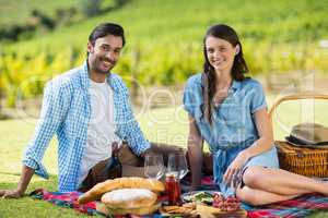 Portrait of happy couple enjoying picnic