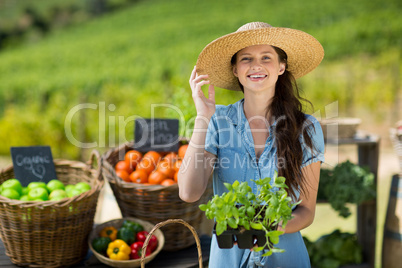 Portrait of woman holding leaf vegetable