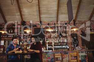 Friends having beer in pub