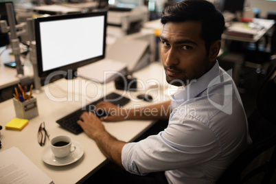 Serious businessman working in office