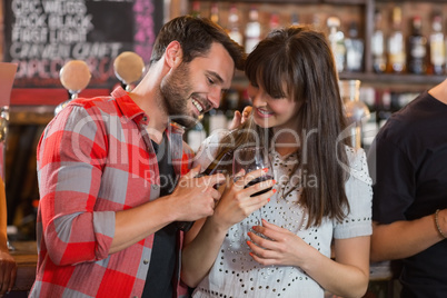 Happy couple holding drinks